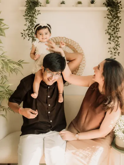 A fun, candid shot of the family playing together in the studio. Real smiles are the best smiles.