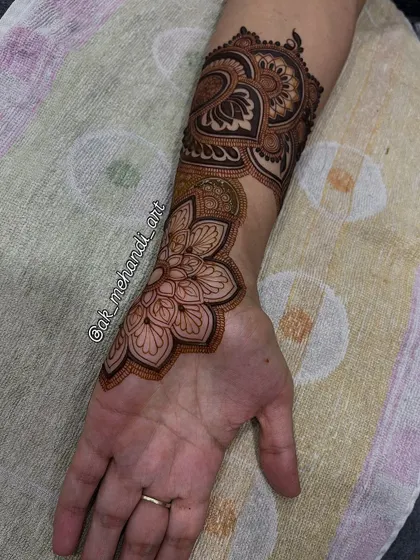 The back of the hand, featuring a large floral motif that complements the full design on the front.