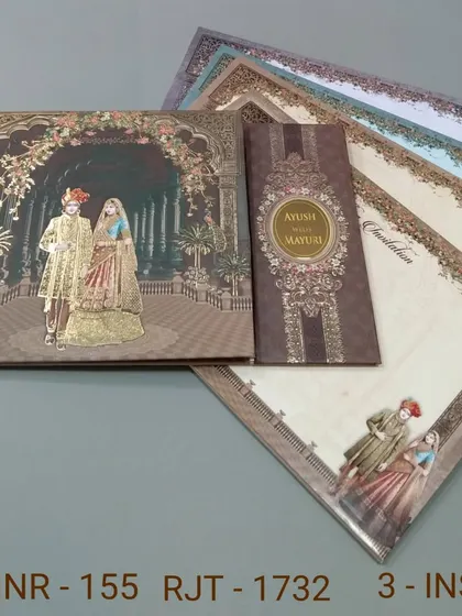 This invitation set features a royal couple in a grand palace hall, with a separate band holding the inserts. The rich brown and gold tones give it a warm and luxurious feel.
