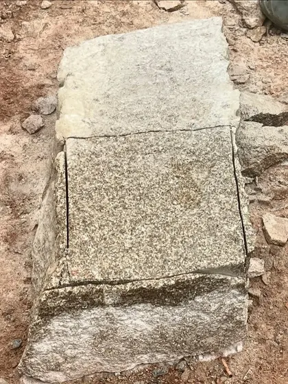 A close-up of a stone block, showing the raw texture and the clean cut line. We are fascinated by the inherent beauty of natural materials and the process of shaping them.