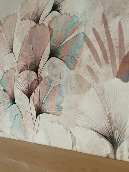 A detailed view of the delicate, pastel-colored ginkgo leaf wallpaper. The soft colors and artistic style are perfect for creating a peaceful and stylish bedroom environment.