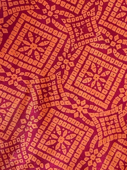 We believe in giving beautiful textiles a second life. This image showcases our overprinting service, where we take a pre-loved vintage Kanjeevaram silk saree from our founder's personal collection and refresh it with a vintage 'chunadi' block print.