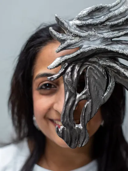 A playful and intimate shot with a horse sculpture, showing the connection I feel with each piece I create.