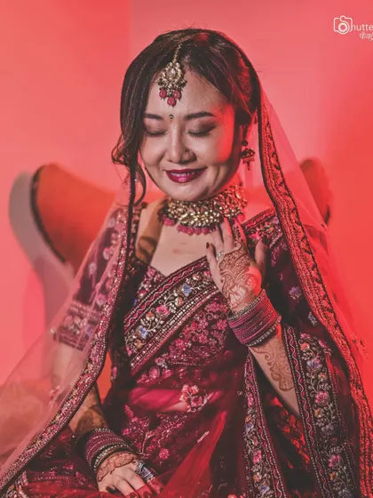 A serene portrait of our beautiful Malaysian bride, showcasing her unique bridal look for her fusion wedding. We celebrate the beauty of all cultures.