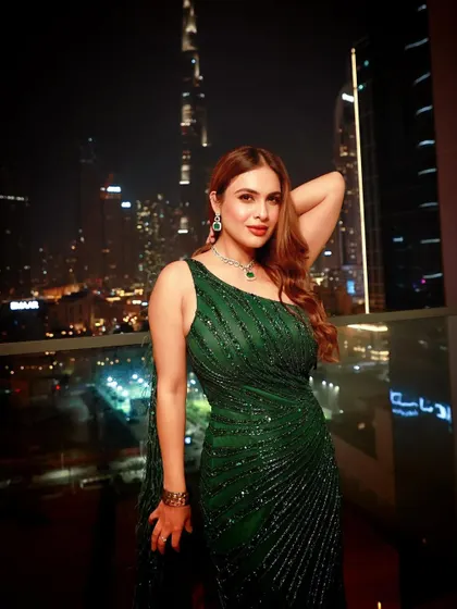 A glitter and glam look I styled for Neha Malik for an event in Dubai. This emerald green sequin gown with a dramatic train was perfect for a night out, set against the stunning backdrop of the Burj Khalifa.