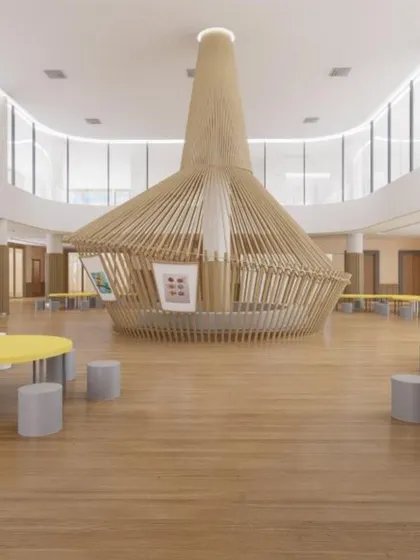 A concept render of a large, open-plan activity area in a school. The central wooden structure and surrounding tables create a dynamic hub for collaboration, play, and learning.