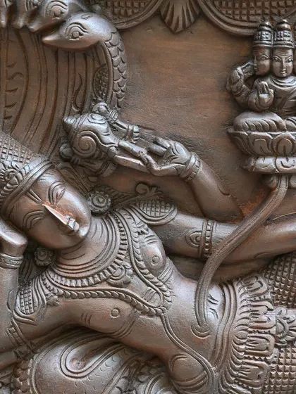 A close-up of Lord Vishnu reclining on the serpent Adisesha, with Lord Brahma emerging from his navel, from our Narayanar panel.