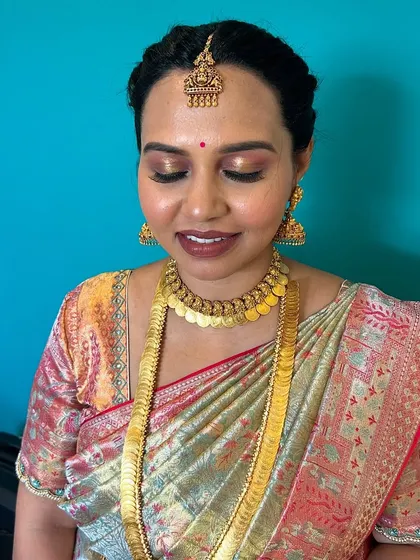 Another view of the eye makeup, showing the gentle shimmer and clean blending. This technique enhances the eyes without looking heavy, perfect for a daytime family function.