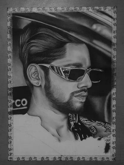 A step-by-step look at my 85-hour portrait of Baseer Ali. You can see the grid lines and how I build up the layers of graphite and charcoal to create a photorealistic effect.