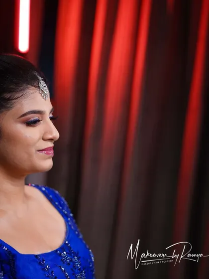 A profile view of Meghana's reception look, showing off the sleek hairstyle and the beautiful shimmer of her eye makeup.