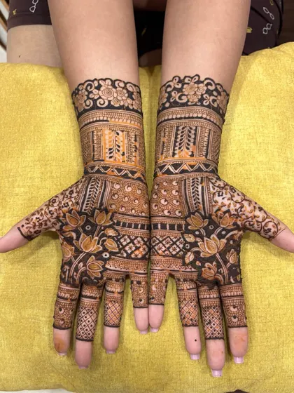 A beautiful and intricate design with floral and geometric elements. The dark stain makes the pattern pop.