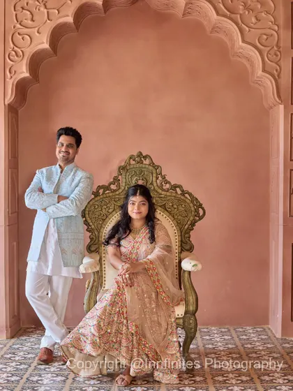 A formal portrait using our ornate throne, creating a look of classic royalty against the backdrop of our pink palace interior.