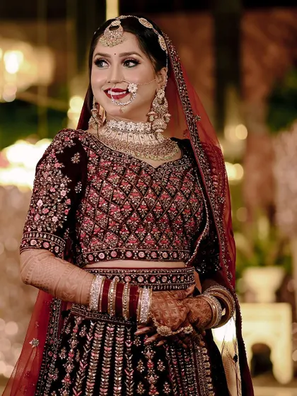 A happy and radiant portrait of the bride, Pooja, on her wedding day.