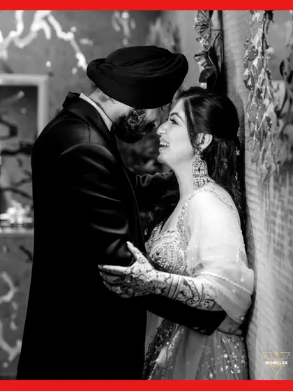 A beautiful black and white portrait, capturing the couple's laughter and genuine connection in an intimate moment.