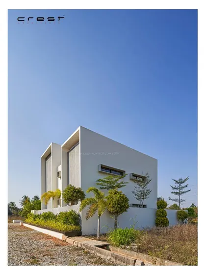 A comparison of the physical model and the final built form of the 'Framed House,' showing the consistency of our design vision.