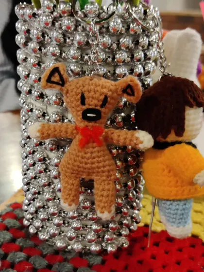 The Mr. Bean teddy keychain on display.