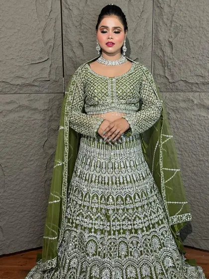 This olive green lehenga with heavy silver embroidery is a showstopper. It’s a fantastic rental option for a bride or bridesmaid for a sangeet or reception.
