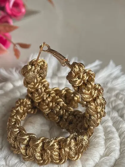 Another look at the golden hoops. They are a great accessory for when you want something that is handmade, unique, and has a bit of sparkle.