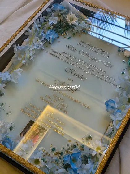 Another view of the custom blue and white wedding Kankotri. The reflection on the glossy surface shows the mirror-like finish I achieve with the final resin coat.