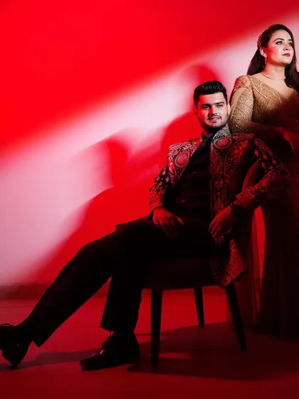 A dramatic, high-fashion portrait using bold red lighting to create a glamorous, magazine-style look. This showcases my ability to craft stylized, Bollywood-inspired pre-wedding photos.