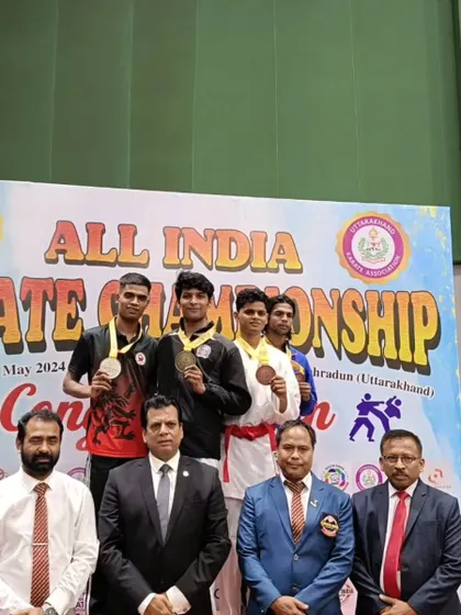 The winners of the senior national karate championship in Dehradun on the podium, including our student Harshit.