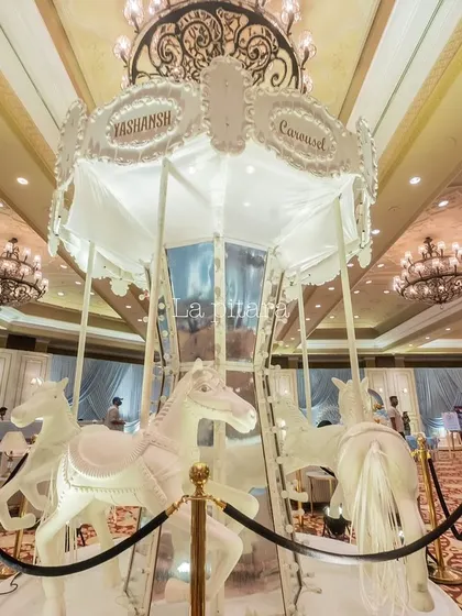 The centerpiece of our carousel-themed party was this stunning, life-sized white carousel with elegant horses. It served as a spectacular photo opportunity and the focal point of the entire event.