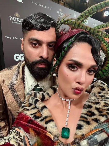 A close-up selfie from the GQ event. You can see the detail of the sleek, gelled finger waves framing the face, a hallmark of the 1920s flapper style.