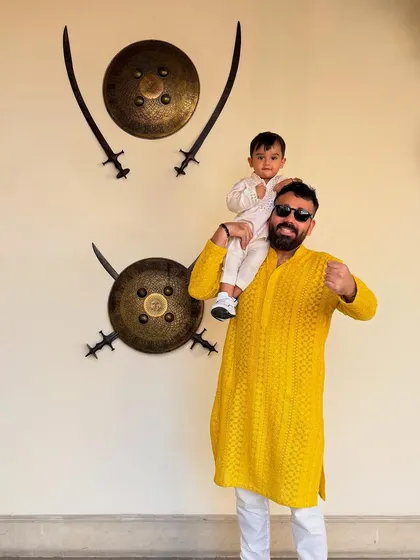 Like father, like son. This vibrant yellow men's kurta is made from our slub silk, while the child's outfit uses our delicate Chanderi, showcasing options for the entire family.