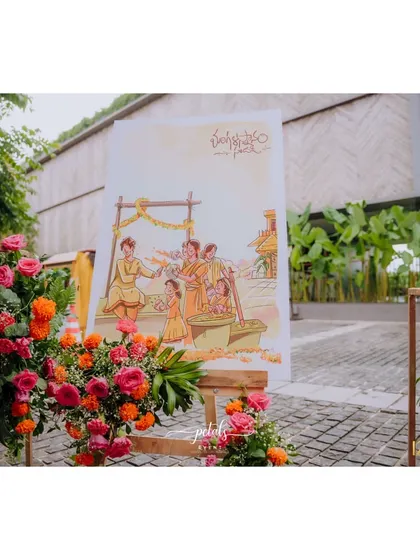 Another shot of the cartoon welcome board, surrounded by beautiful floral arrangements. It's a perfect example of how I can customize decor to reflect the couple's personality.