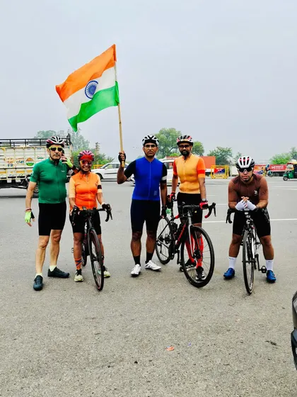 The group stands together with the flag, showing our unity and pride on Independence Day.