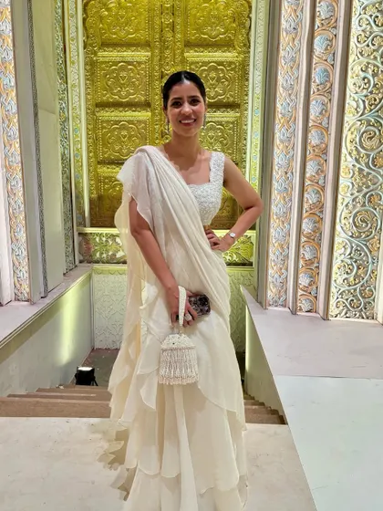 Another shot of my ruffled saree look for the Ambani wedding. The tiered ruffles added a modern touch to the classic saree silhouette, making it perfect for the "Indian chic" theme.