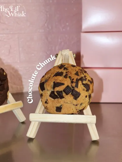 Our classic Chocolate Chunk NY-style cookie, displayed like a little piece of art. It's packed with generous chunks of chocolate.