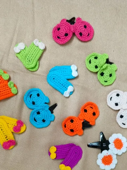 A collection of my colourful and fun hair clips. I have made them in many shapes like little footballs, watermelons, and cherries. These handmade clips are a cute accessory for any hairstyle.