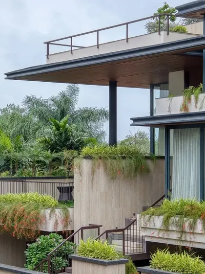 A closer look at the tiered planters and staircases that animate the facade, creating a dynamic relationship between the building and its landscape.