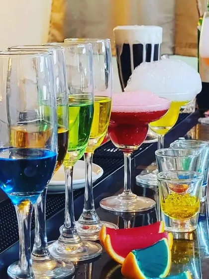 A full bar setup showcasing a variety of our molecular creations, from layered drinks to foams and smoke.