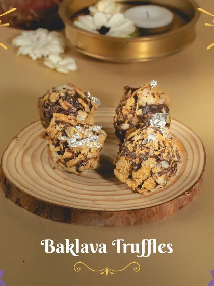 My Baklava Truffles are a bite-sized version of the classic dessert, blending crunchy nuts and honey with rich chocolate, finished with a touch of edible silver.