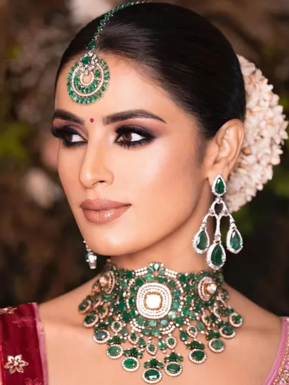 A close-up of a classic bridal look, showcasing a sharp, black smokey eye. I teach how to create this intense look without it looking harsh, ensuring it enhances the eyes beautifully.