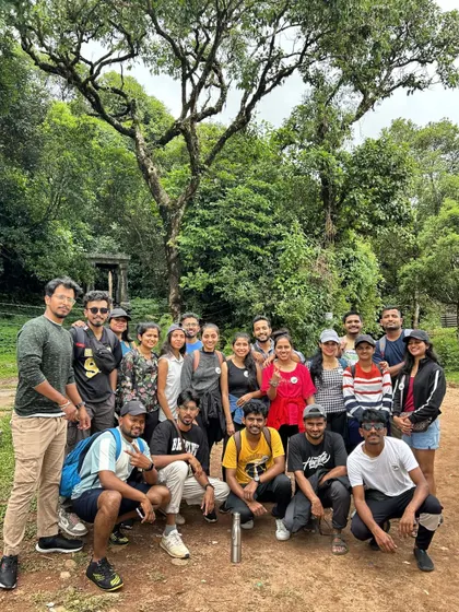 A group photo in the forest, ready to start the day's adventure.