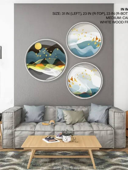 This dynamic set of three circular prints depicts abstract mountain landscapes with golden birds. The use of day and night themes across the set creates a narrative of time and nature, enhanced by modern white wood frames.