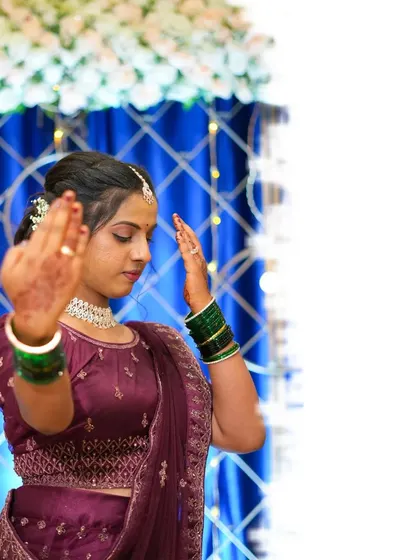 A portrait of the bride in a dance-like pose, adding a sense of movement and grace to her photos.
