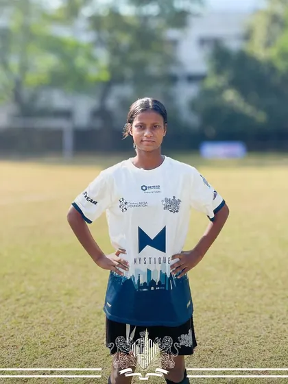 A portrait of another key player from our women's team. Her confidence and readiness reflect the professional training and supportive environment we provide.