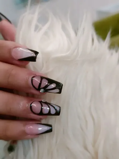 A close-up shot of the butterfly wing design, showing the clean lines and negative space.