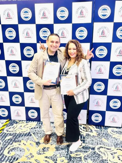 Celebrating a successful presentation with a colleague at Dermacon. Sharing our work and getting feedback from peers is an essential part of professional growth.