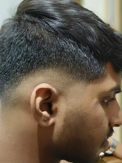 Your best look starts with the right grooming. A clean fade on a male client.
