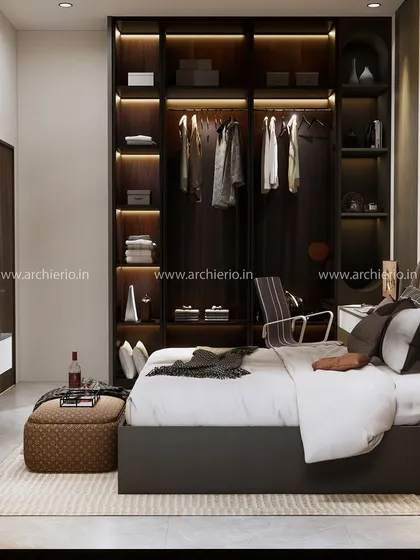 A modern master bedroom with a dark, open-concept wardrobe, a sleek TV unit, and an integrated study desk.
