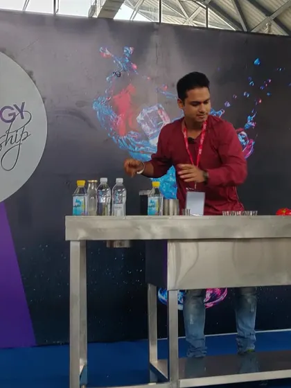 A bartender carefully constructs his competition cocktail. Every ingredient and movement is planned and practiced.