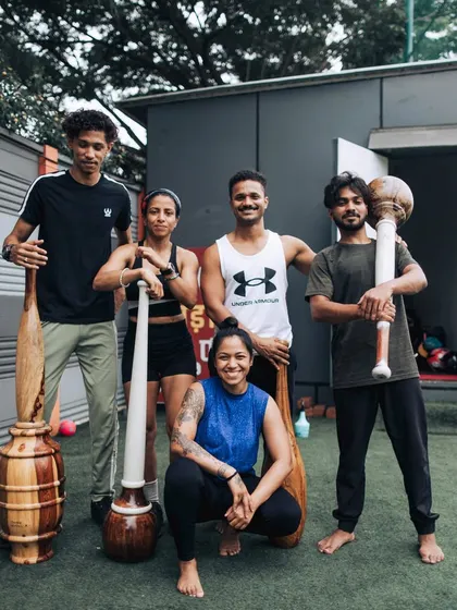 A group of newly certified instructors and participants pose with their Gadas and Mudgars. This image captures the sense of community and shared accomplishment that is a hallmark of our certification programs.