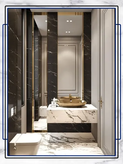 A glimpse into opulence. This bathroom uses dramatic black and white marble, a gold-finished sink, and elegant wall paneling to create a truly luxurious space.