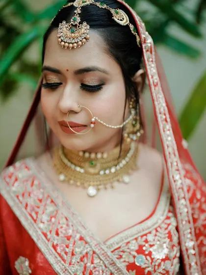 A close-up on beauty. This shot focuses on the bride's flawless makeup and a portion of her intricate jewelry, highlighting the details that complete the bridal look.