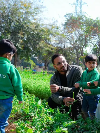 A group of pre-schoolers from Imperio School gets a hands-on lesson in the vegetable patch. It's a perfect real-world extension of their classroom learning.
